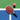 Pickleball paddle laying on blue and green marked court, a daylight shot with strong sun shadows; high-angle top view